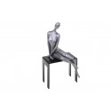 Sculpture, statuette de femme sur un banc