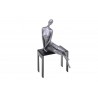 Sculpture, statuette de femme sur un banc