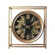 Mechanical clock in gold color with visible gears